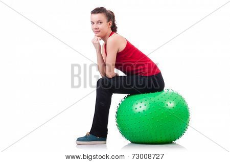 Young woman exercising with swiss ball