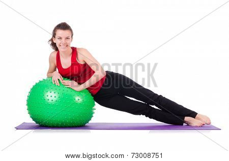 Young woman exercising with swiss ball