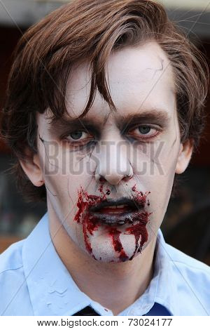 MUSKOGEE, OK - Sept. 13: A bloody zombie looks for runners during the Castle Zombie Run at the Castle of Muskogee in Muskogee, OK on September 13, 2014. 