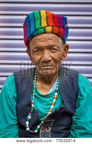 KATHMANDU, NEPAL - APRIL 2 - Portrait of an unidentified man with nice rainbow hat on APRIL 2, 2014, Nepal.