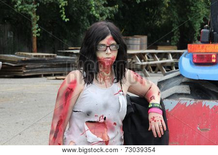 MUSKOGEE, OK - Sept. 13: A bloody zombie looks waits for runners during the Castle Zombie Run at the Castle of Muskogee in Muskogee, OK on September 13, 2014. 