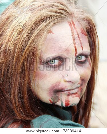 MUSKOGEE, OK - Sept. 13: A bloody zombie looks waits for runners during the Castle Zombie Run at the Castle of Muskogee in Muskogee, OK on September 13, 2014. 