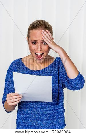 a young woman gets bad news in a letter in the mail