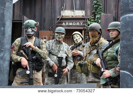 MUSKOGEE, OK - Sept. 13: Soldiers dressed in camouflage are ready to hunt zombies during the Castle Zombie Run at the Castle of Muskogee in Muskogee, OK on September 13, 2014. 