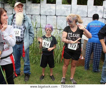 MUSKOGEE, OK - Sept. 13: Runners wait for the start of second annual Castle Zombie Run at the Castle of Muskogee in Muskogee, OK on September 13, 2014. 
