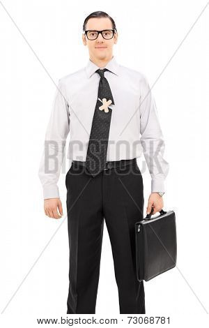 Businessman with a messy tie split in half and connected by a bandage isolated on white background