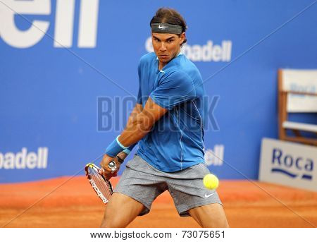 BARCELONA - APRIL, 24: Spanish tennis player Rafa Nadal in action during a match of Barcelona tennis tournament Conde de Godo on April 24, 2014 in Barcelona