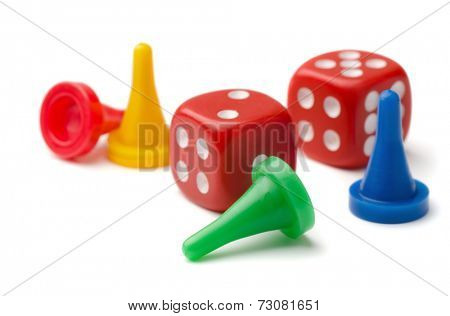 Colorful pawns and dices isolated on white