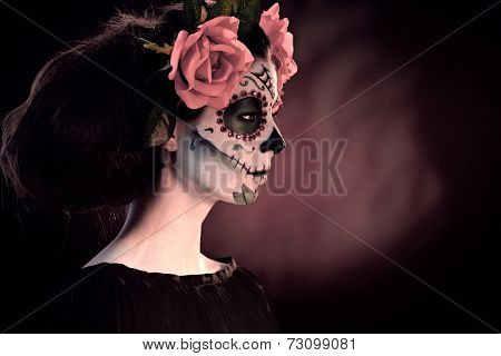 Woman in Halloween makeup - mexican Santa Muerte mask.