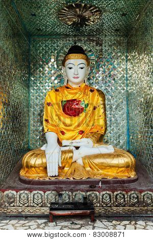 Buddha statue in Burma famous sacred place and tourist attraction landmark - Shwedagon Paya pagoda. Yangon, Myanmar
