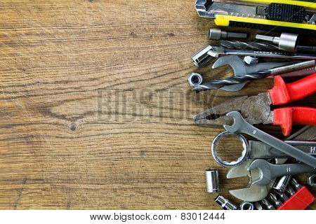 set of tools on wood board background