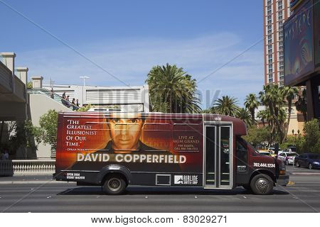 Airline shuttle bus with David Copperfield advertisement on Las Vegas Strip