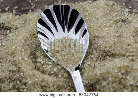 brown cane sugar with silver spoon