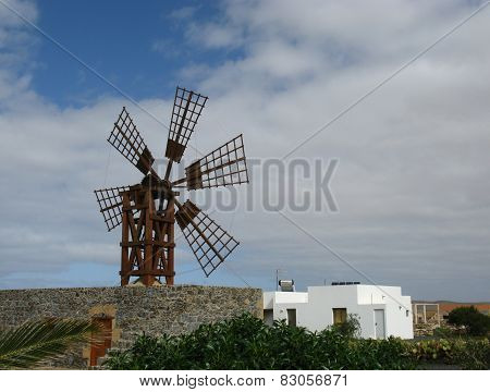 A wooden wind mill with six wings