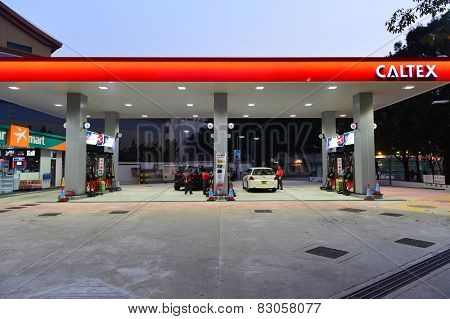 HONG KONG - FEBRUARY 04, 2015: Caltex fuel station at evening. Caltex is a petroleum brand name of Chevron Corporation used in more than 60 countries