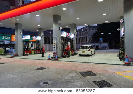 HONG KONG - FEBRUARY 04, 2015: Caltex fuel station at evening. Caltex is a petroleum brand name of Chevron Corporation used in more than 60 countries