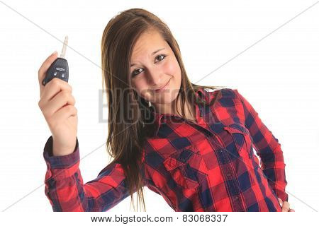 A teen holding key in front of a white background