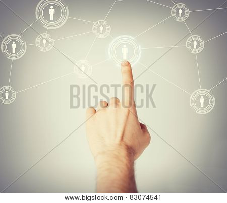 business, technology, internet and networking concept - man hand pressing button with contact on virtual screens