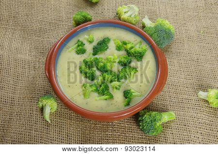 appetizing broccoli soup on a jute background