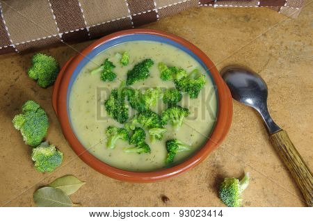 broccoli soup on a brown stone background