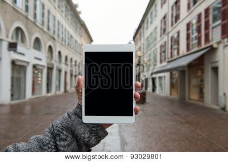Digital tablet with isolated screen in male hands.