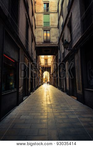 Straight narrow street in Gothic quarter, Barcelona.