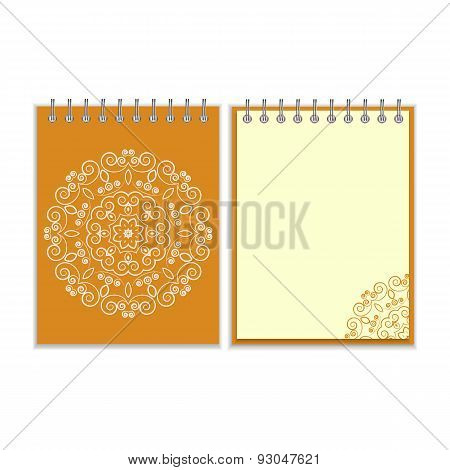 Orange cover notebook with round floral pattern