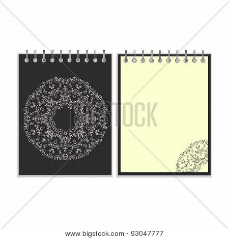 Black cover notebook with round ornate pattern