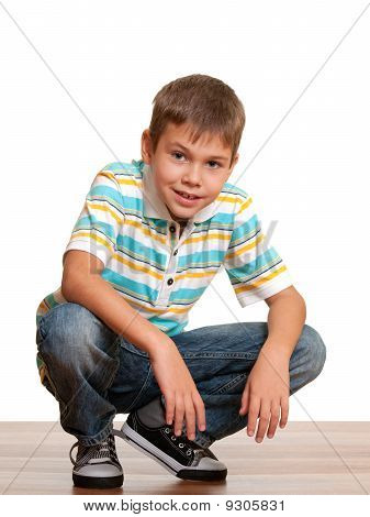 Mosolygó Squating fiú