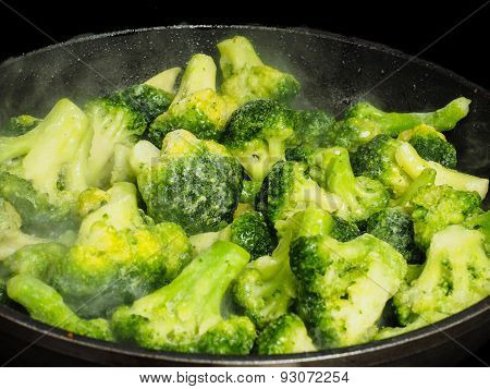 Thawing Frozen Green Broccoli In A Hot Fry Pan