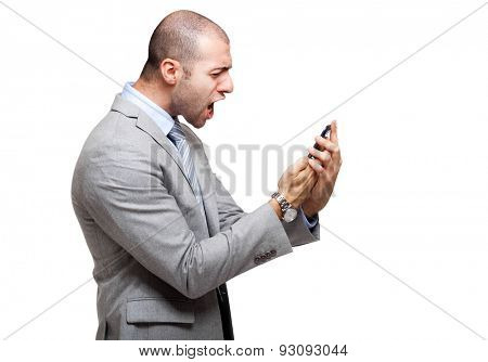 Angry man screaming at his phone