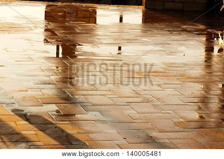 Puddle of water in rainy day