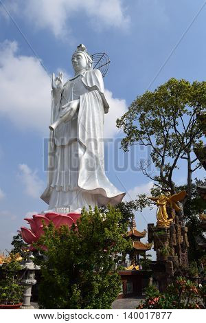 big statue of Bodhisattva at Buddhist Chau Thoi temple Binh Duong Vietnam