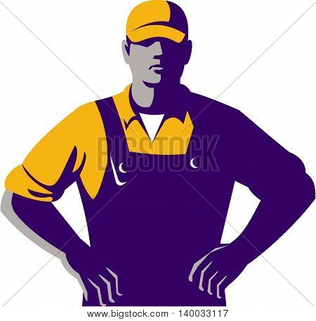 Illustration of an organic farmer wearing hat and overalls with hands on hips akimbo facing front set on isolated white background done in retro style.