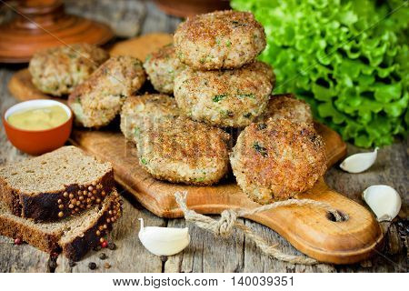 Homemade meat cutlets delicious baked pork cutlets in crispy breading in rustic style selective focus