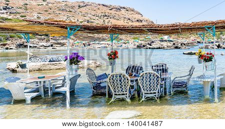 A unique Greek family tavern with tables in the sea. Located in the picturescue 