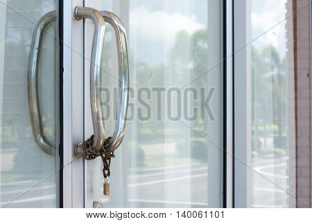 Door handles, stainless steel chain with a lock.
