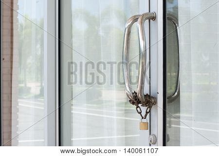 Door handles, stainless steel chain with a lock.