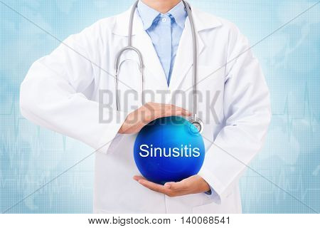 Doctor holding blue crystal ball with sinusitis sign on medical background.