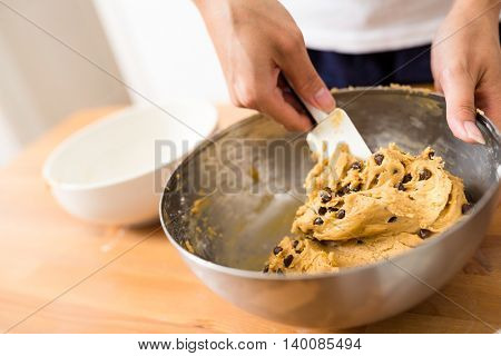 Stirring the dough in bowl