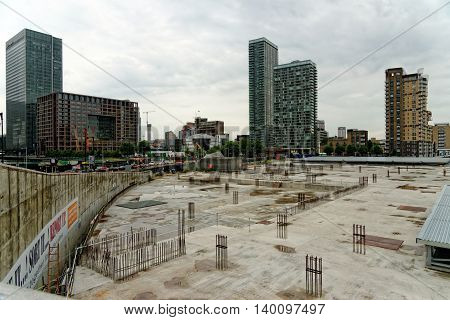 LONDON UK - JUNE 30 2014: Canary Wharf located in West India Docks on Isle of Dogs once formed part of the busiest port in world. Now it is a major business district (1300000 sqm) in London.
