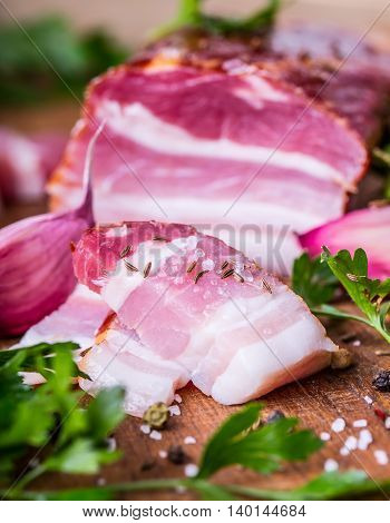 Bacon. Smoked bacon parsley herb salt pepper and garlic.Stll life studio shot.