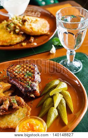 grilled meat with potato pancakes
