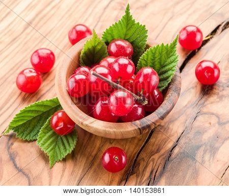 Nanking or felted cherry ftuits with leaves on the wooden table.