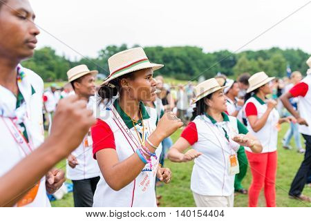 Poznan POLAND - JULY 24 2016: pilgrims praying dancing and singing during Days In Dioceses just before The World Youth Day in Krakow; WYD is a meeting of youth from all over the world