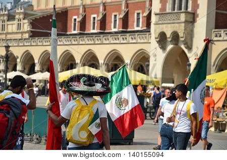 KRAKOW POLAND - JUL 27 2016: World youth day 2016.International Catholic youth Convention. Young people on Main Square in Krakow.