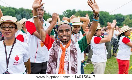 Poznan POLAND - JULY 24 2016: pilgrims praying dancing and singing during Days In Dioceses just before The World Youth Day in Krakow; WYD is a meeting of youth from all over the world