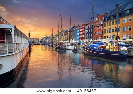 Copenhagen, Nyhavn Canal. Image of Nyhavn Canal in Copenhagen, Denmark during beautiful sunset.