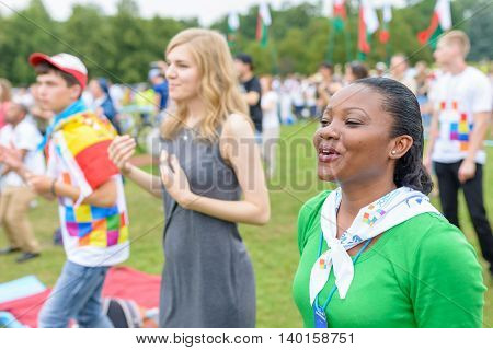 Poznan POLAND - JULY 24 2016: pilgrims praying dancing and singing during Days In Dioceses just before The World Youth Day in Krakow; WYD is a meeting of youth from all over the world