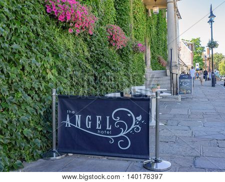 Bury St Edmunds/UK. 18th July 2016. The Angel Hotel has a small cafe terrace overlooking the Abbey Gardens to the front.